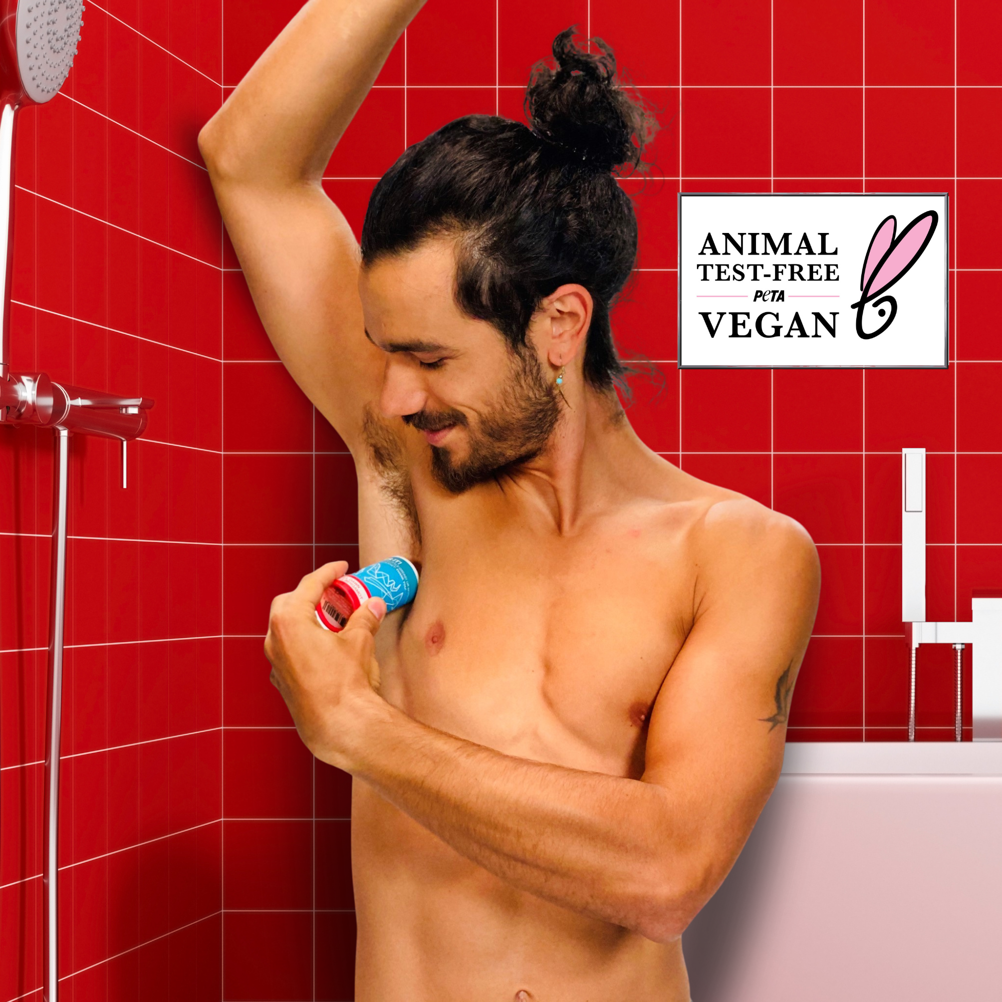 Man applying deodorant in a bathroom with red tiles, featuring an 'Animal Test-Free' and 'Vegan' logo.