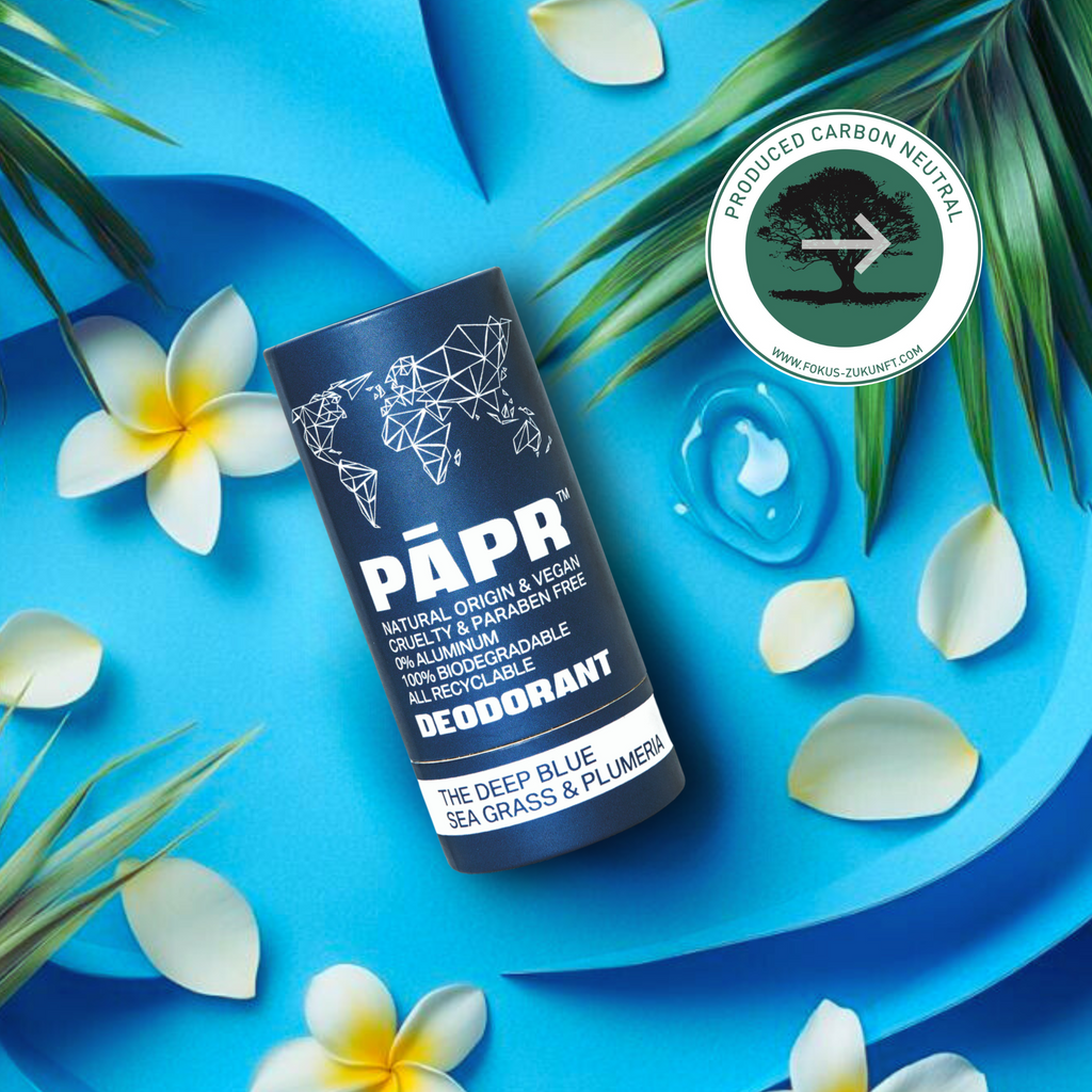 PAPR deodorant container on a blue background with flowers and palm leaves