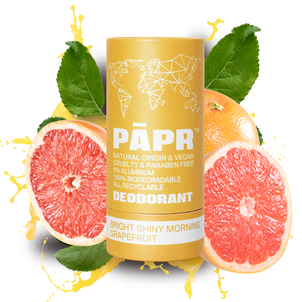 PAPR deodorant stick with grapefruit slices and leaves on a white background