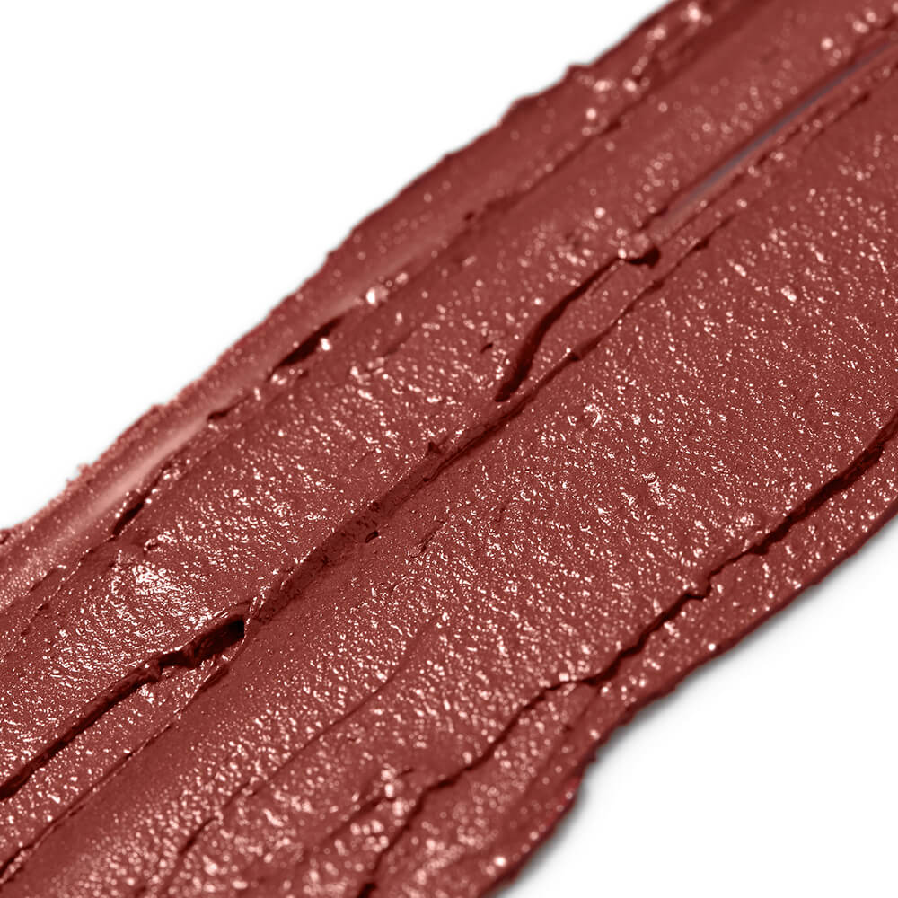 Close-up of a neutral pink lipstick swatch on a white background