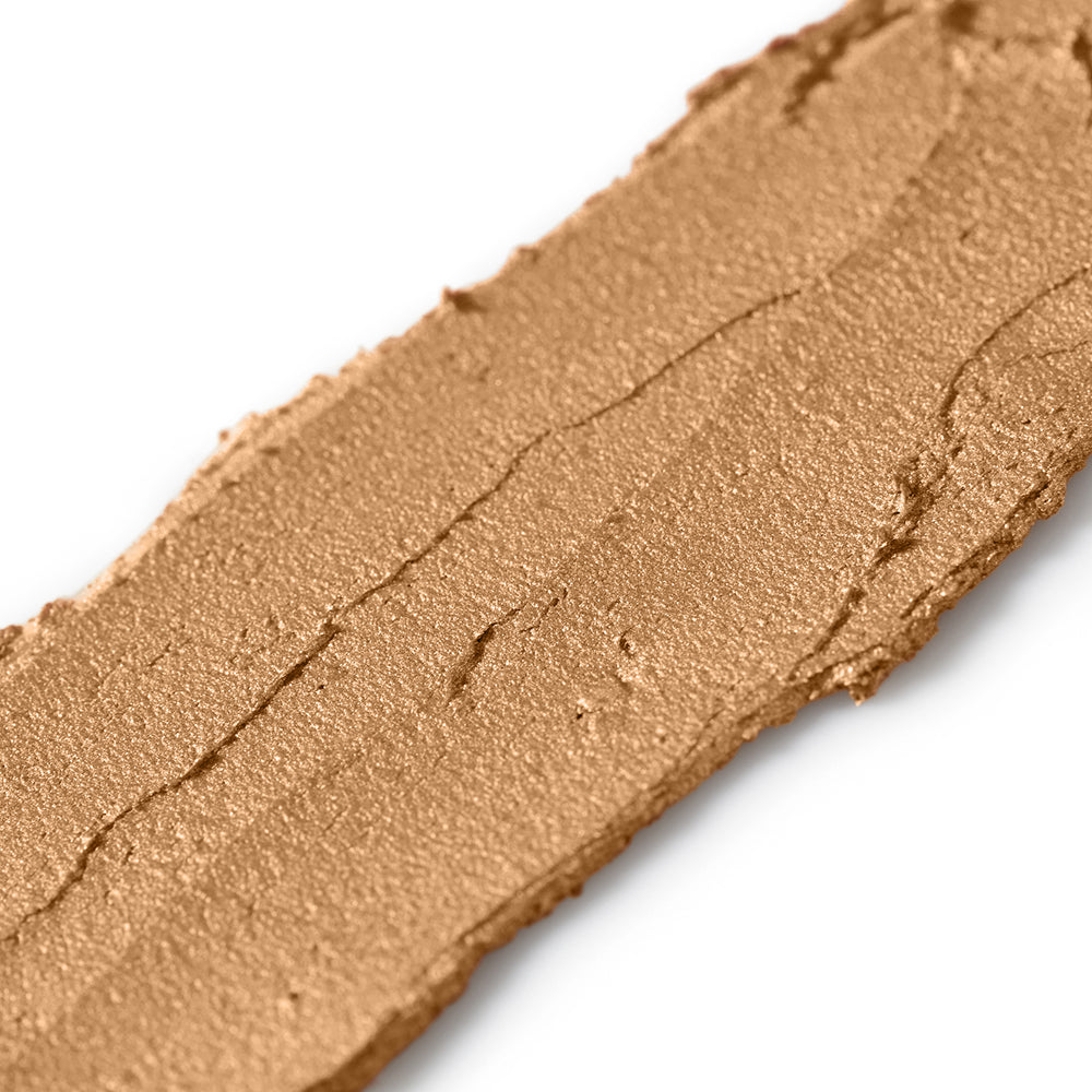 Close-up of a brown makeup swatch on a white background