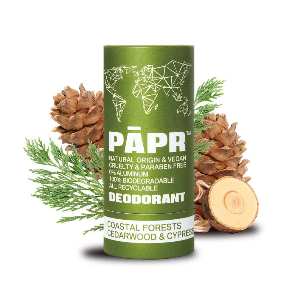 Green deodorant container with natural elements on a transparent background