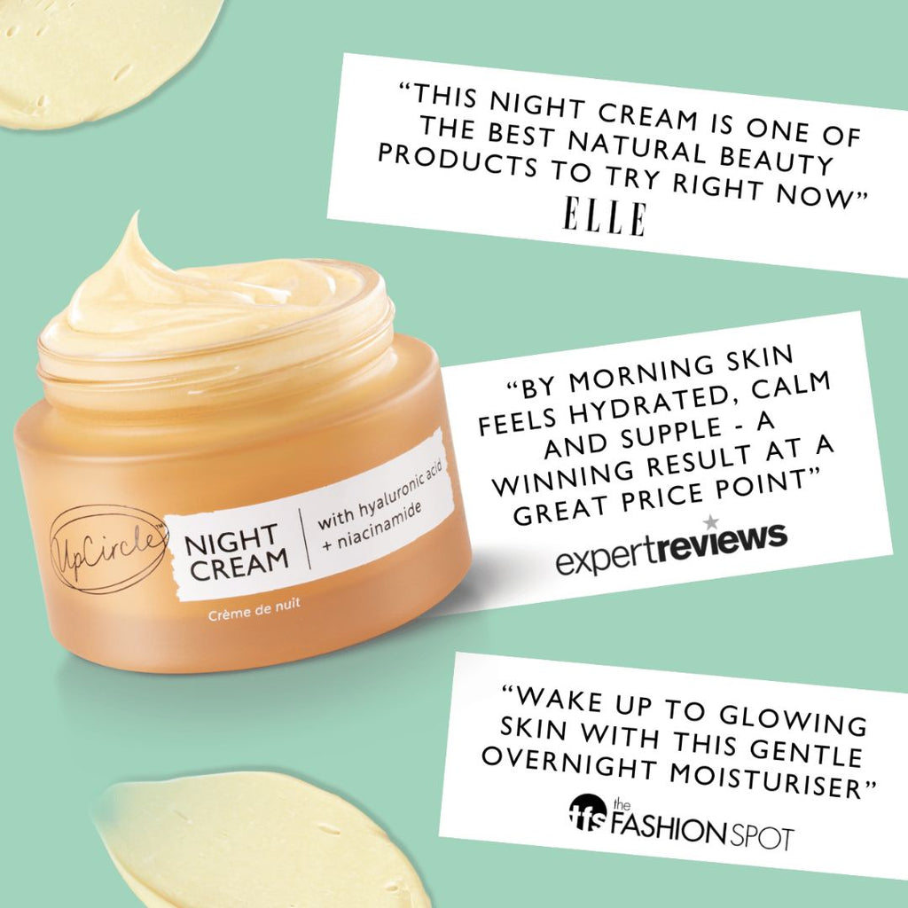 Jar of night cream with positive reviews on a light green background