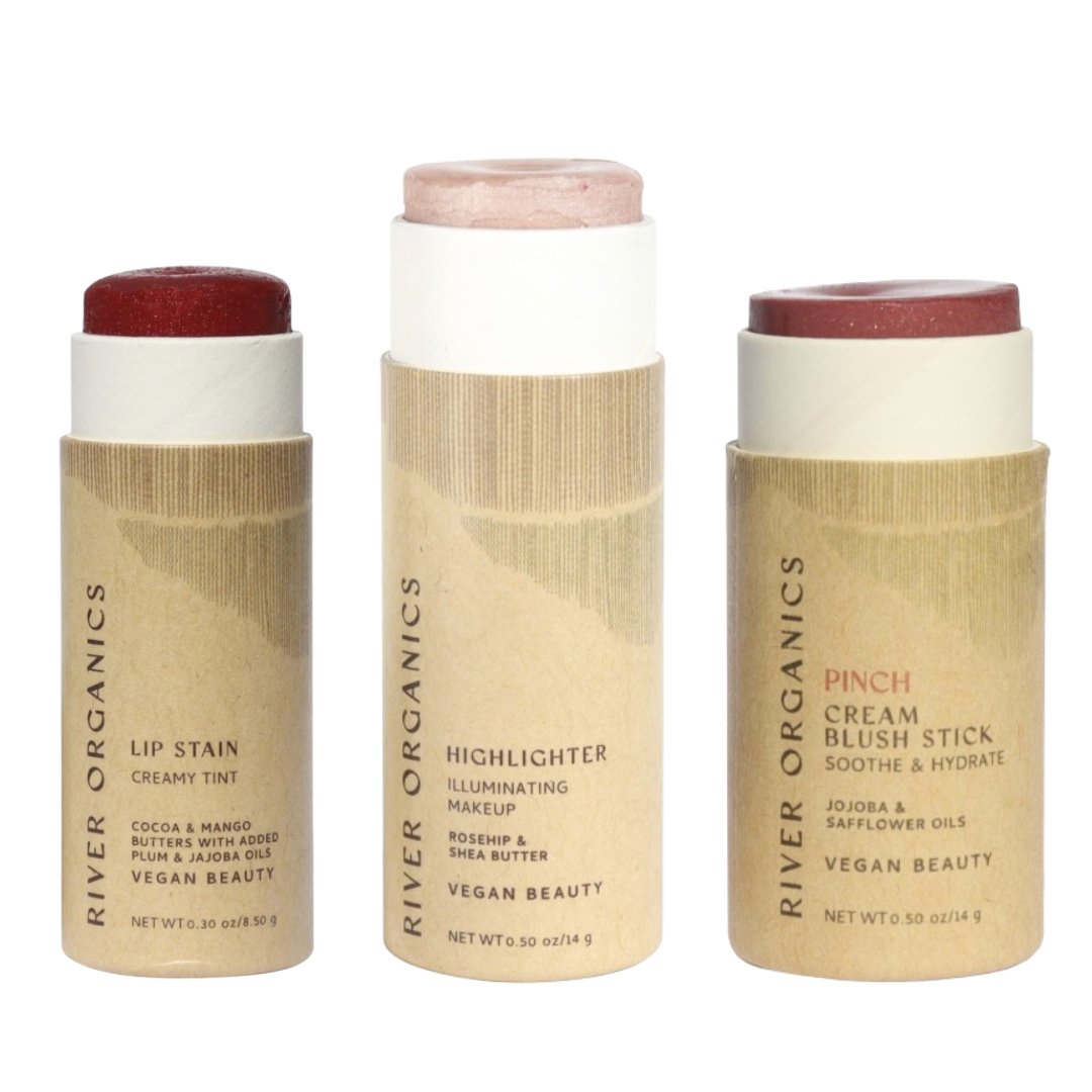 Three River Organics makeup sticks on a white background