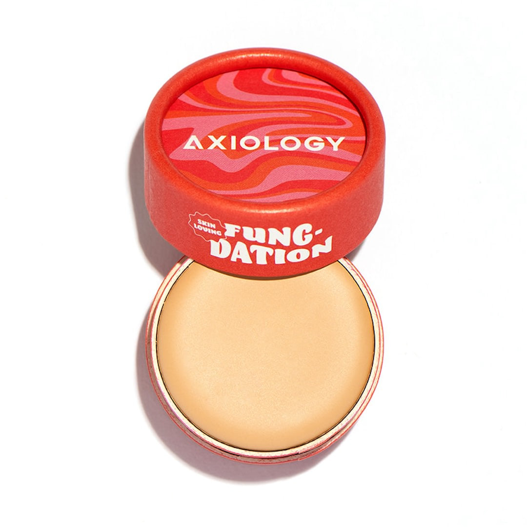 Open container of Axiology Fung'ation foundation on a white background