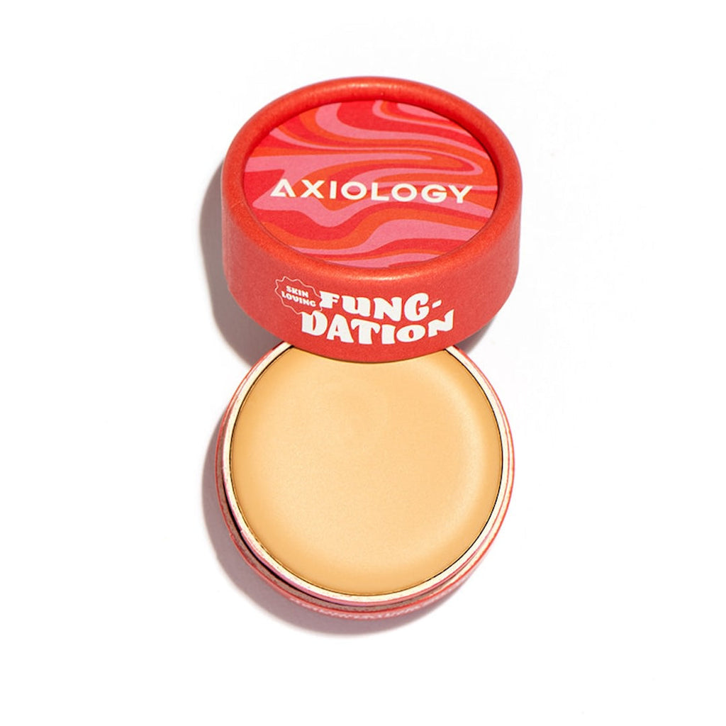 Foundation product with red lid labeled 'Axiology' on a white background