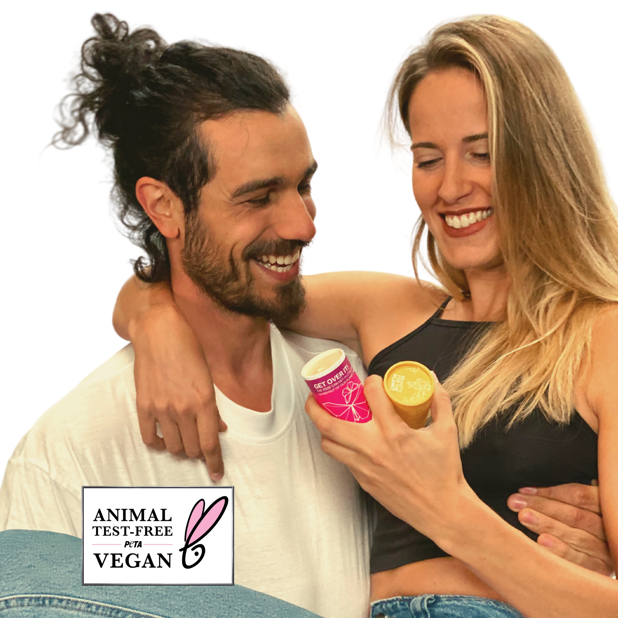 Man and woman embracing, with a product in hand, against a white background. Vegan certification logo visible.