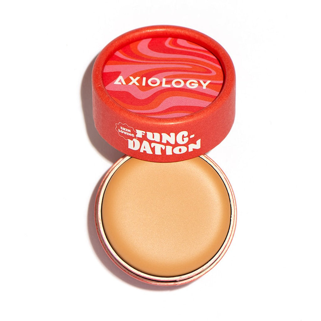 Foundation pot with red lid displaying 'Axiology' branding on a white background