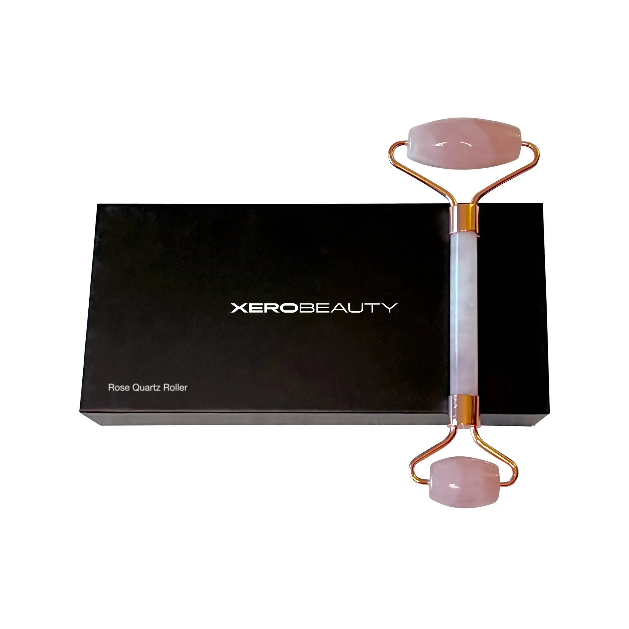 Rose Quartz Roller with Xero Beauty packaging on a white background