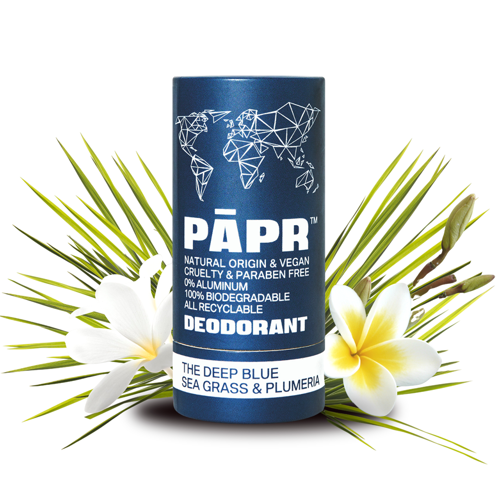 PAPR deodorant container with world map design on a white background with flowers and sea grass.