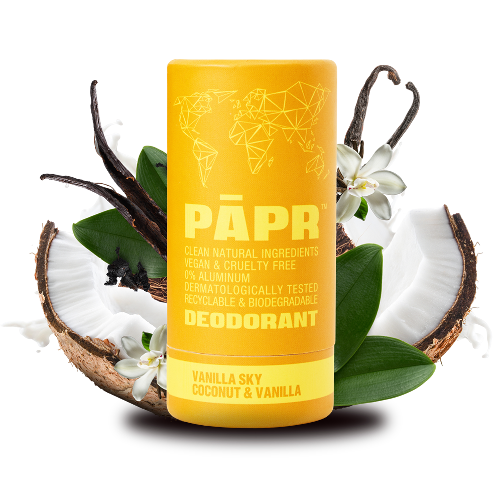 Yellow deodorant stick with vanilla and coconut elements on a white background