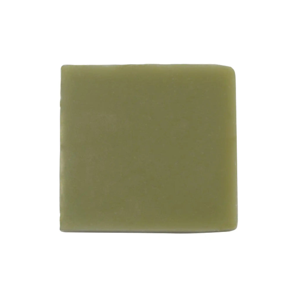 Green soap bar on a white background