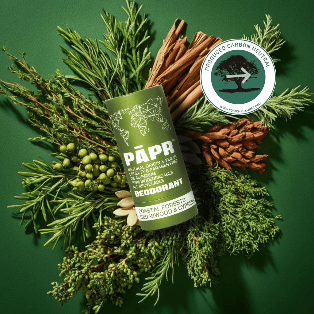 PAPR deodorant stick surrounded by natural elements on a green background