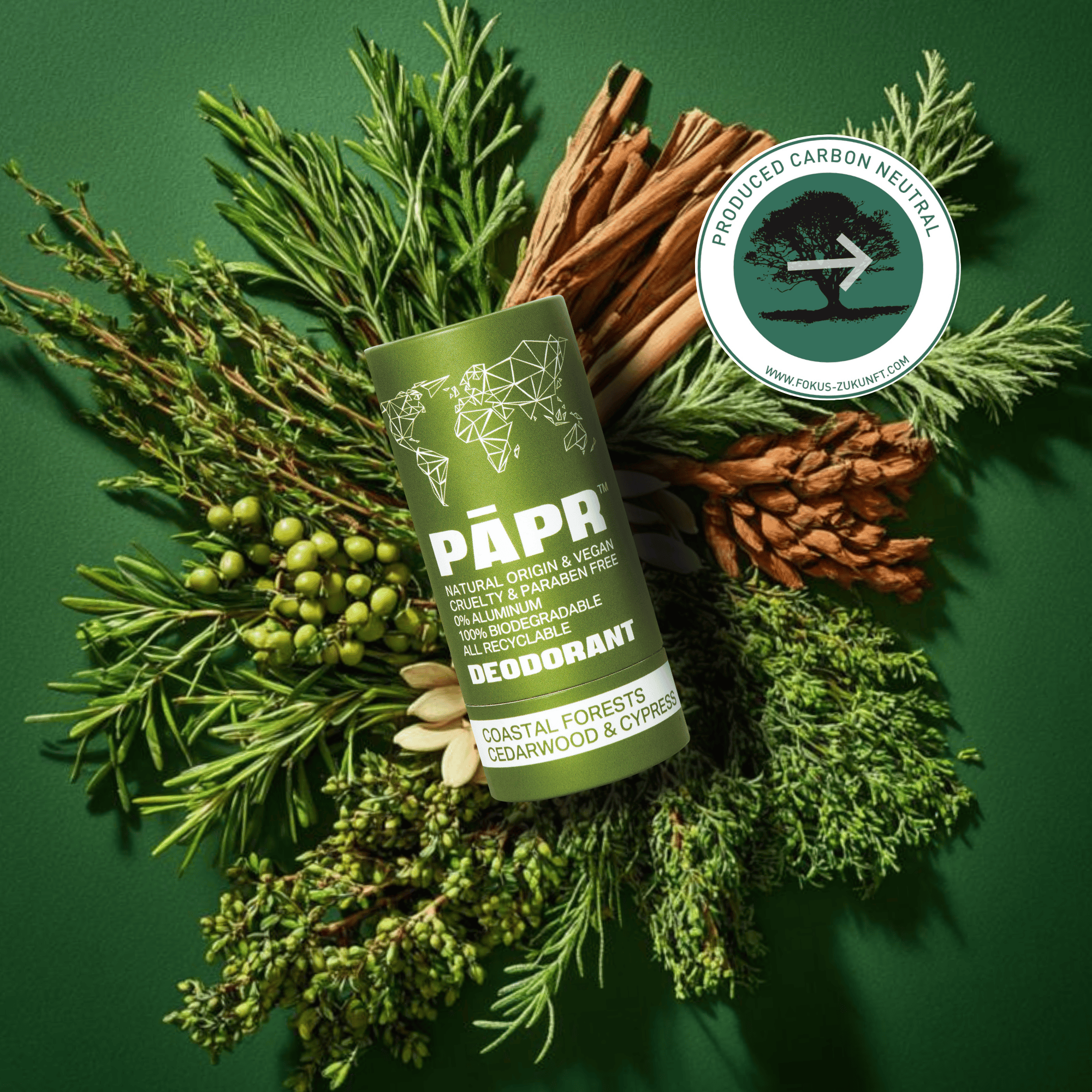 PAPR deodorant stick surrounded by natural elements on a green background