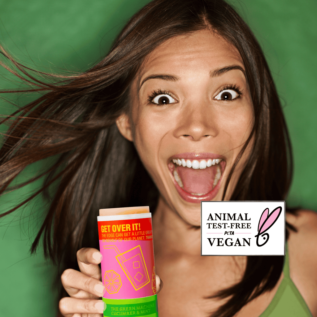 Woman holding a product with a 'Vegan' and 'Animal Test-Free' label on a green background