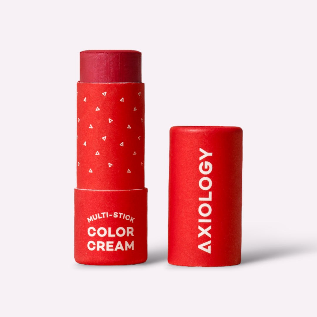 Red Axiology multi-stick color cream on a white background