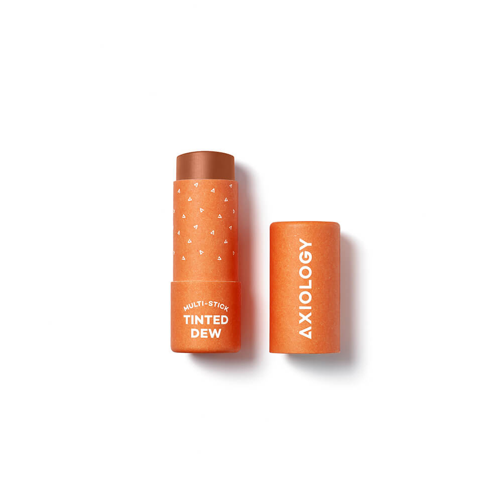 Orange cosmetic stick with 'Axiology' branding on a white background