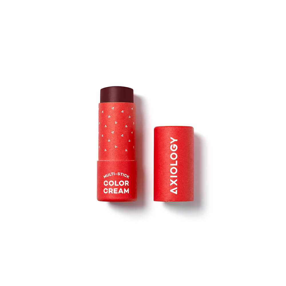 Dark red cosmetic stick with 'Axiology' branding on a white background