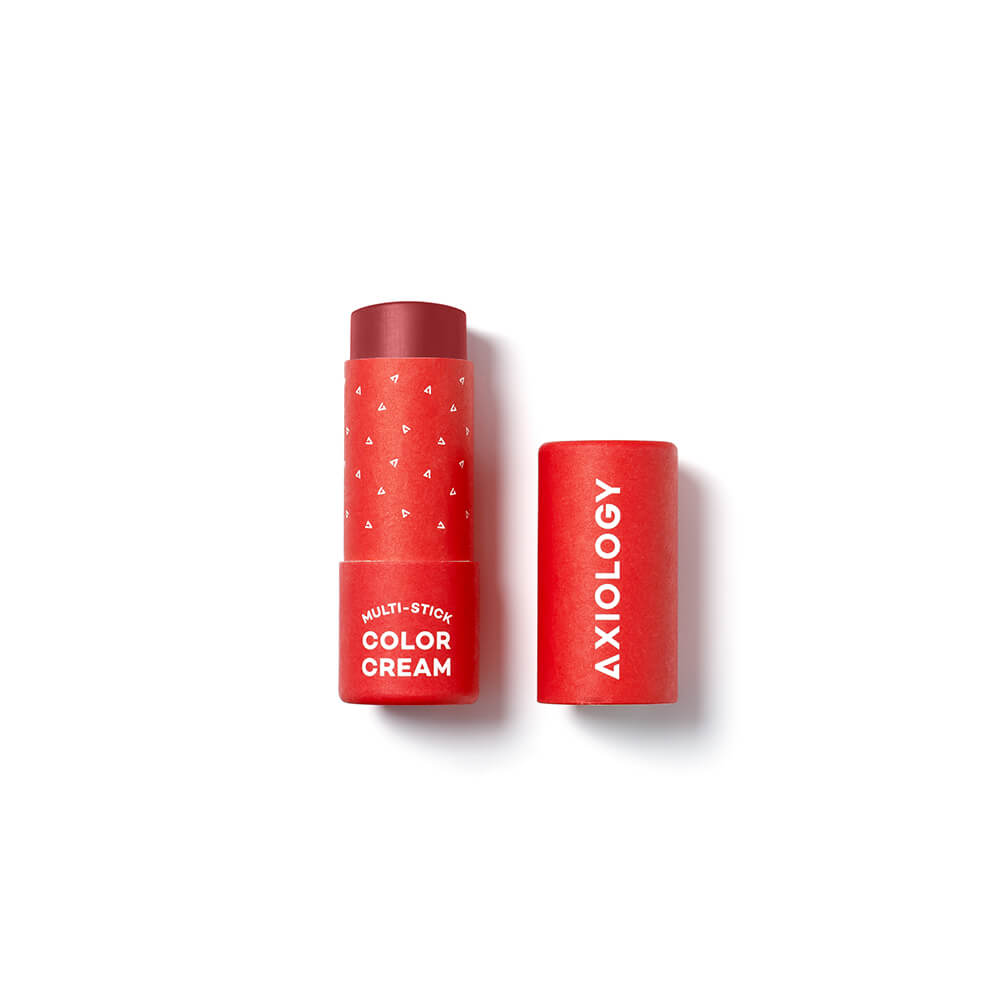 Red cosmetic stick with 'Axiology' branding on a white background