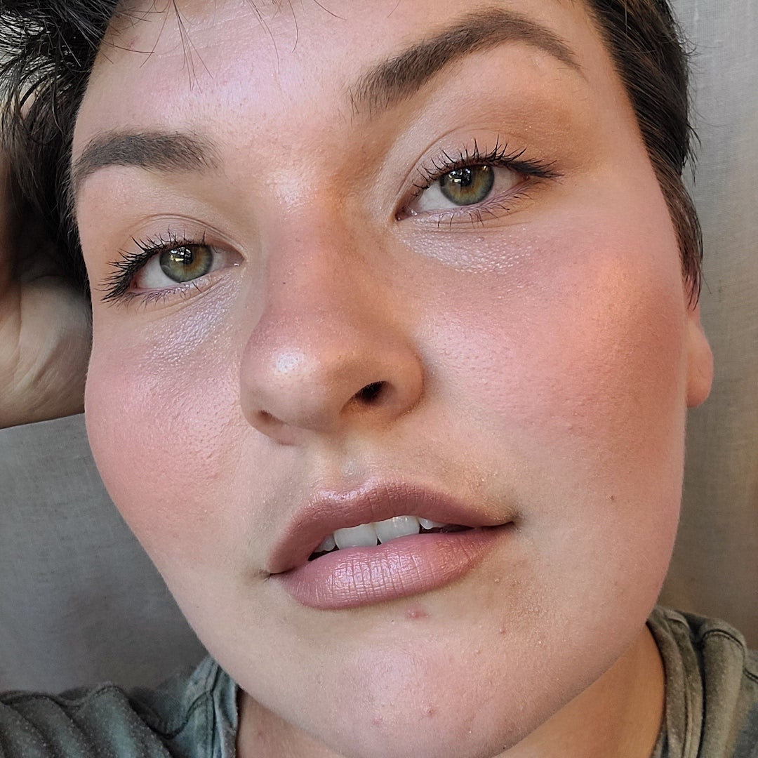 Close-up of a person's face with neutral background