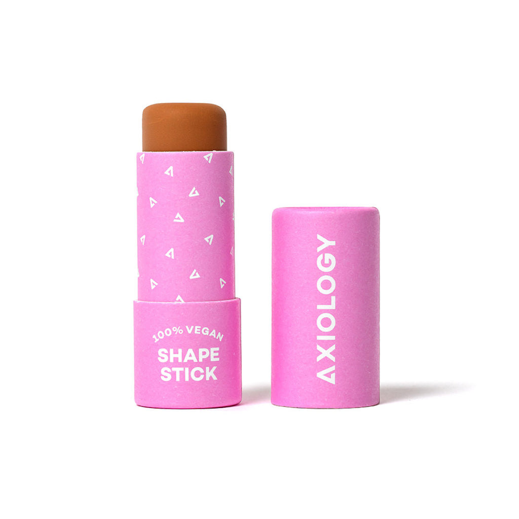 Pink cosmetic stick with top, labeled 'Axiology' on a white background