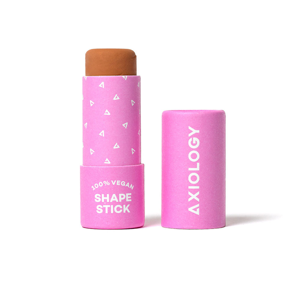 Pink cosmetic stick with 'Axiology' branding on a white background