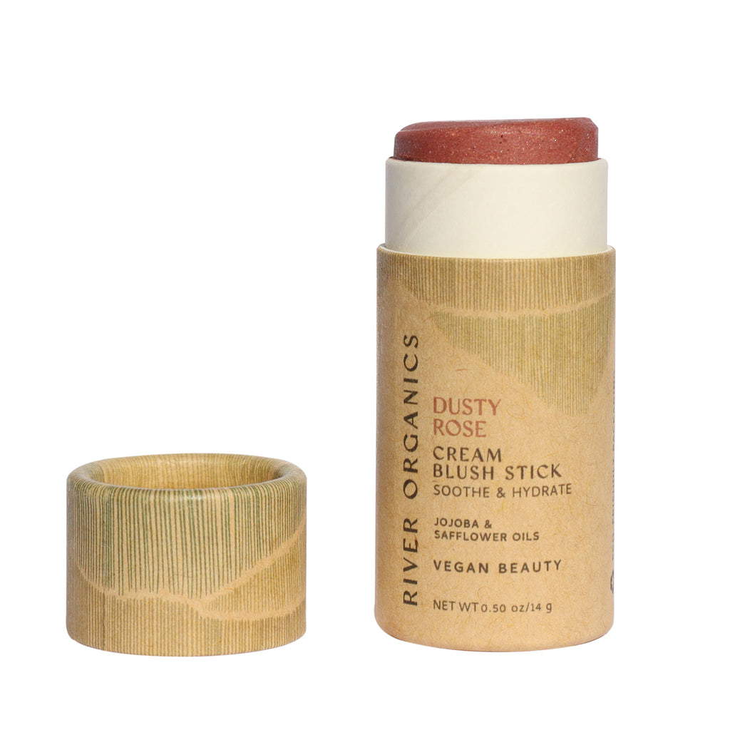 Cream blush stick with paper casing on a white background