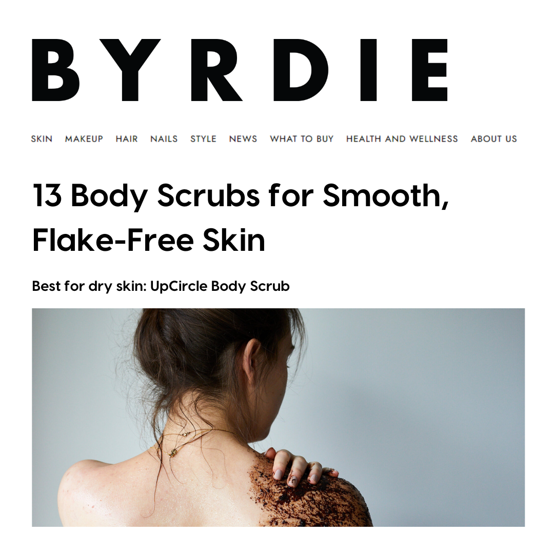 Byrdie article about body scrubs with a woman applying scrub to her back.