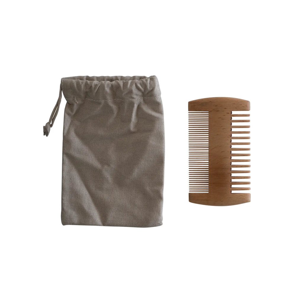 Brown drawstring bag and bamboo comb on a white background