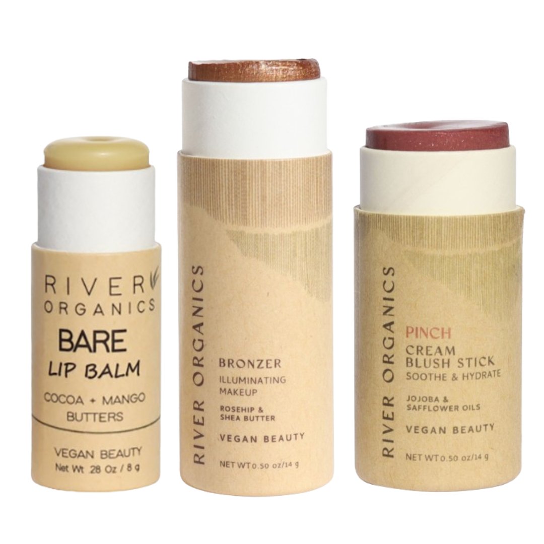 Three River Organics makeup sticks on a white background