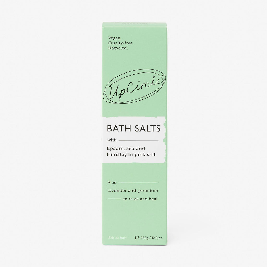 Green box of UpCircle bath salts on a white background