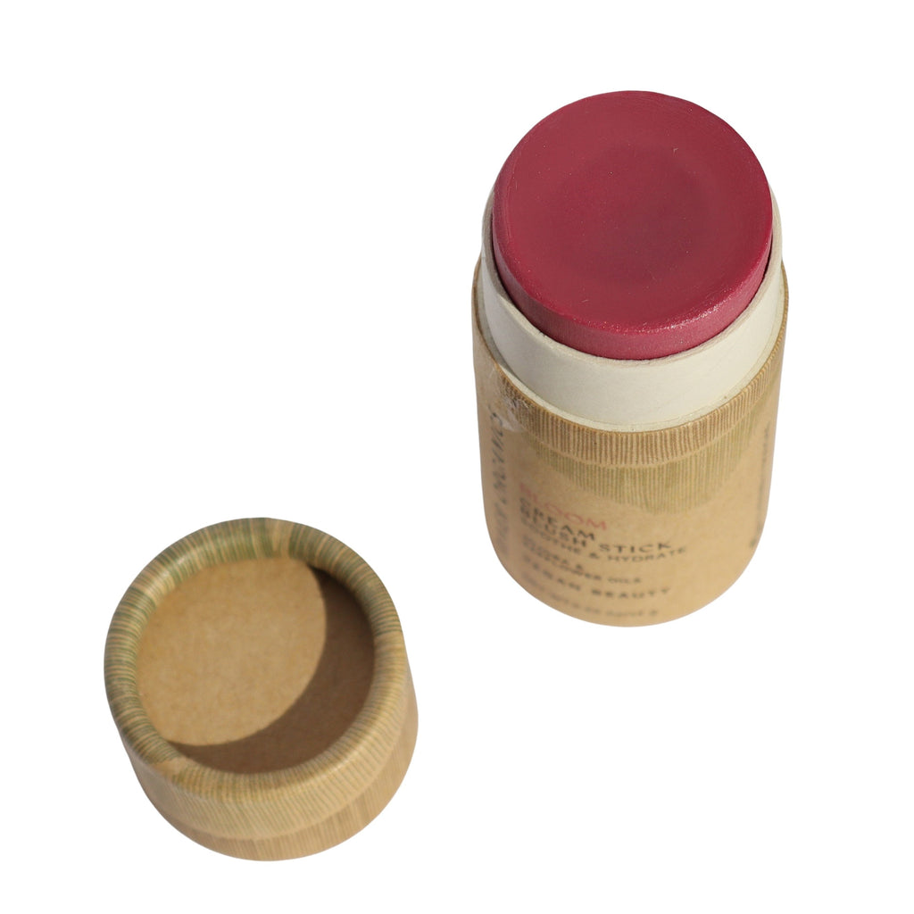 Blush stick with paper packaging and lid on a white background