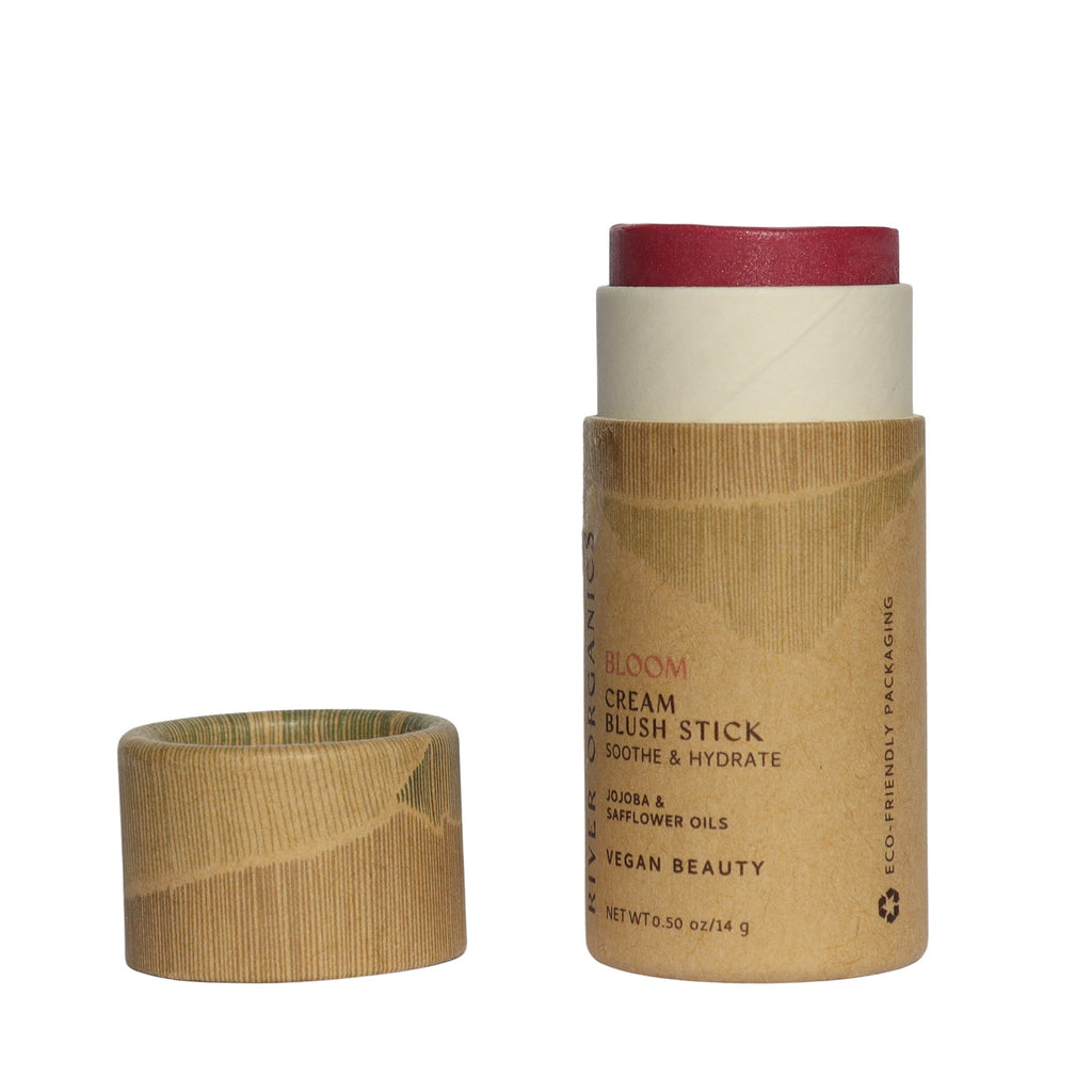 Cream blush stick with paper packaging on a white background