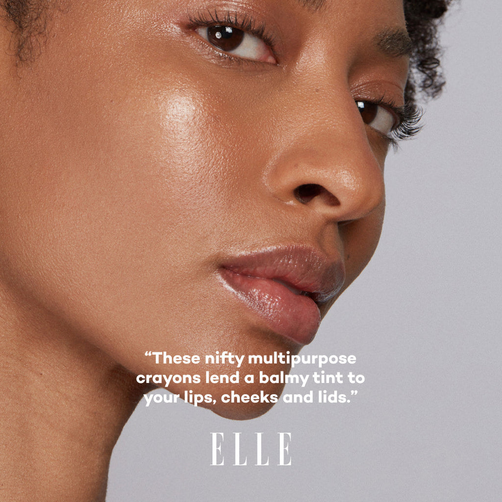 Close-up of a person's face with a quote about multipurpose crayons and the Elle logo.