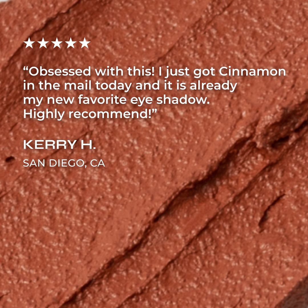 Close-up of 'cinnamon' lip crayon cosmetic swatch with a five-star rating and review text overlay.