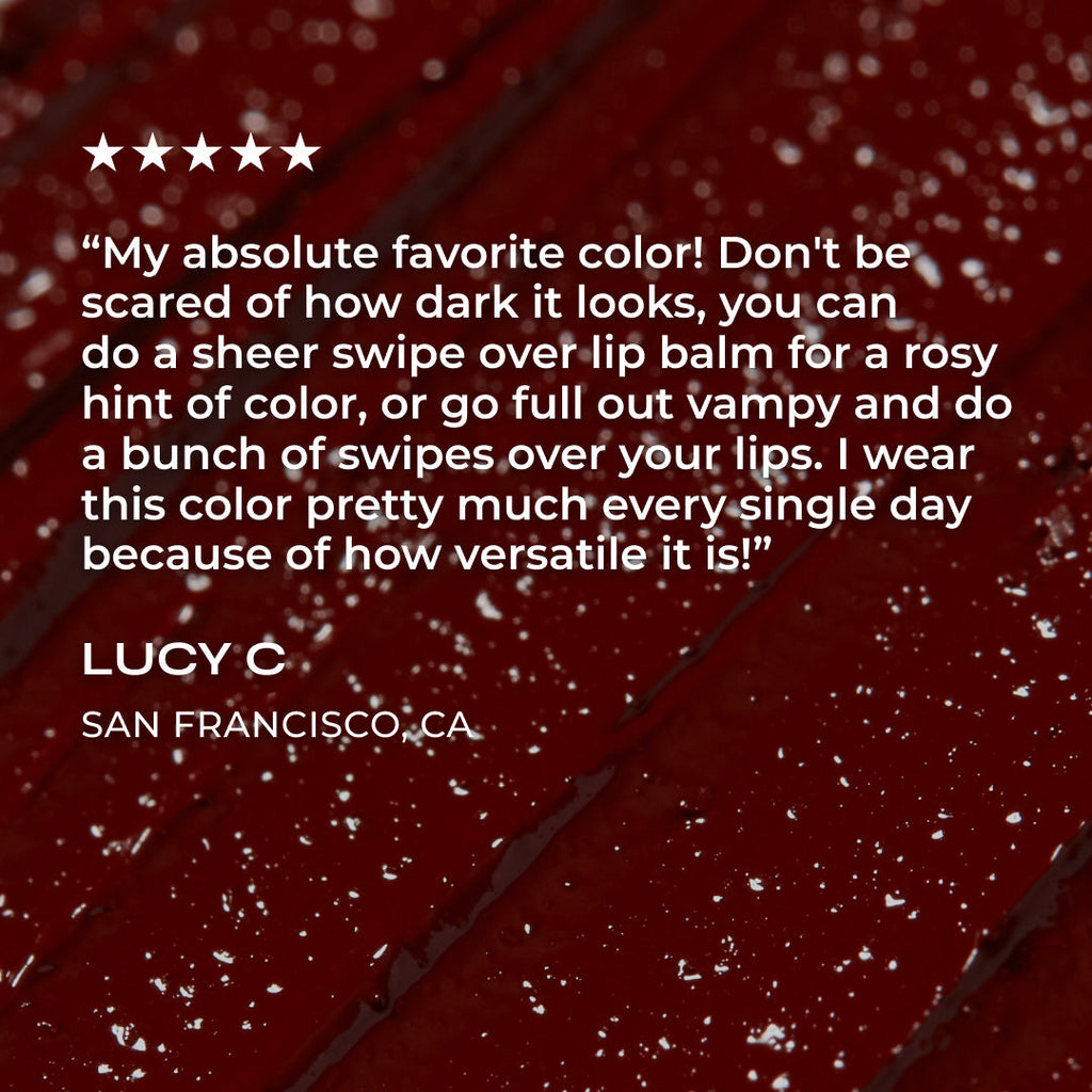 Red lipstick with text and star rating on a dark red background