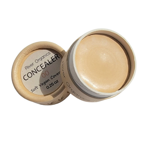 Open container of River Organics concealer on a white background