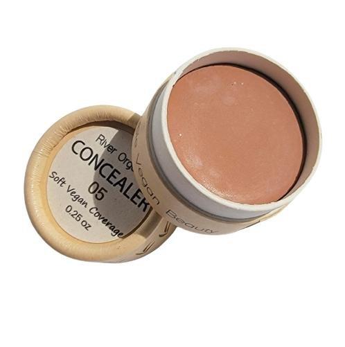 Open concealer container with visible brand name on a white background