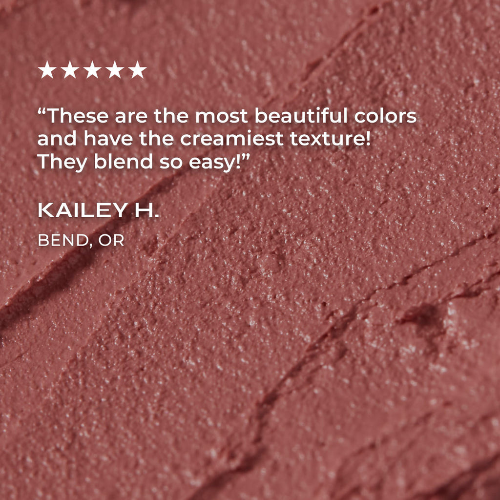 Close-up of a makeup product with a five-star rating and review text on a red-brown background.