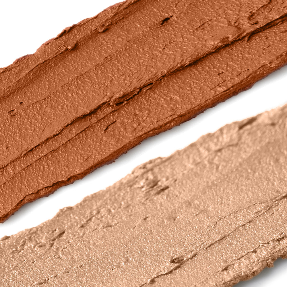 Close-up of brown makeup swatches on a white background