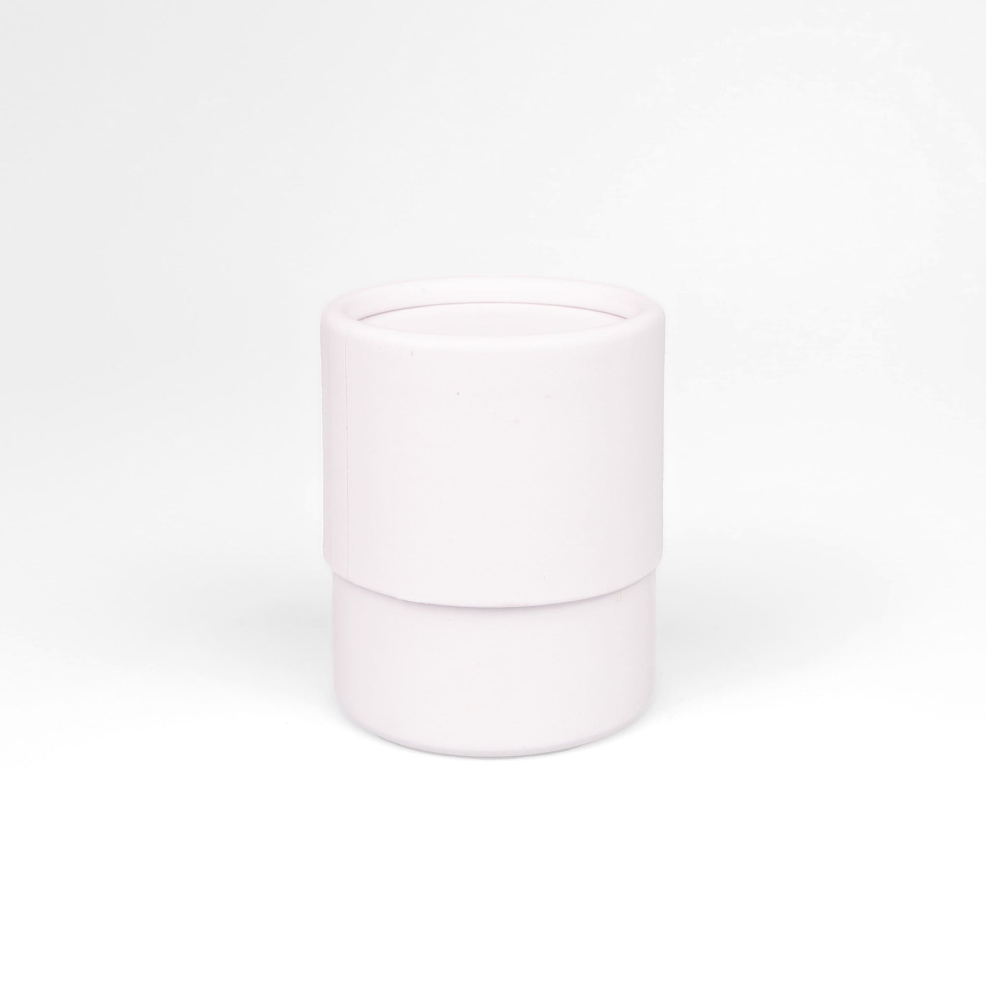 White cylindrical container on a white background