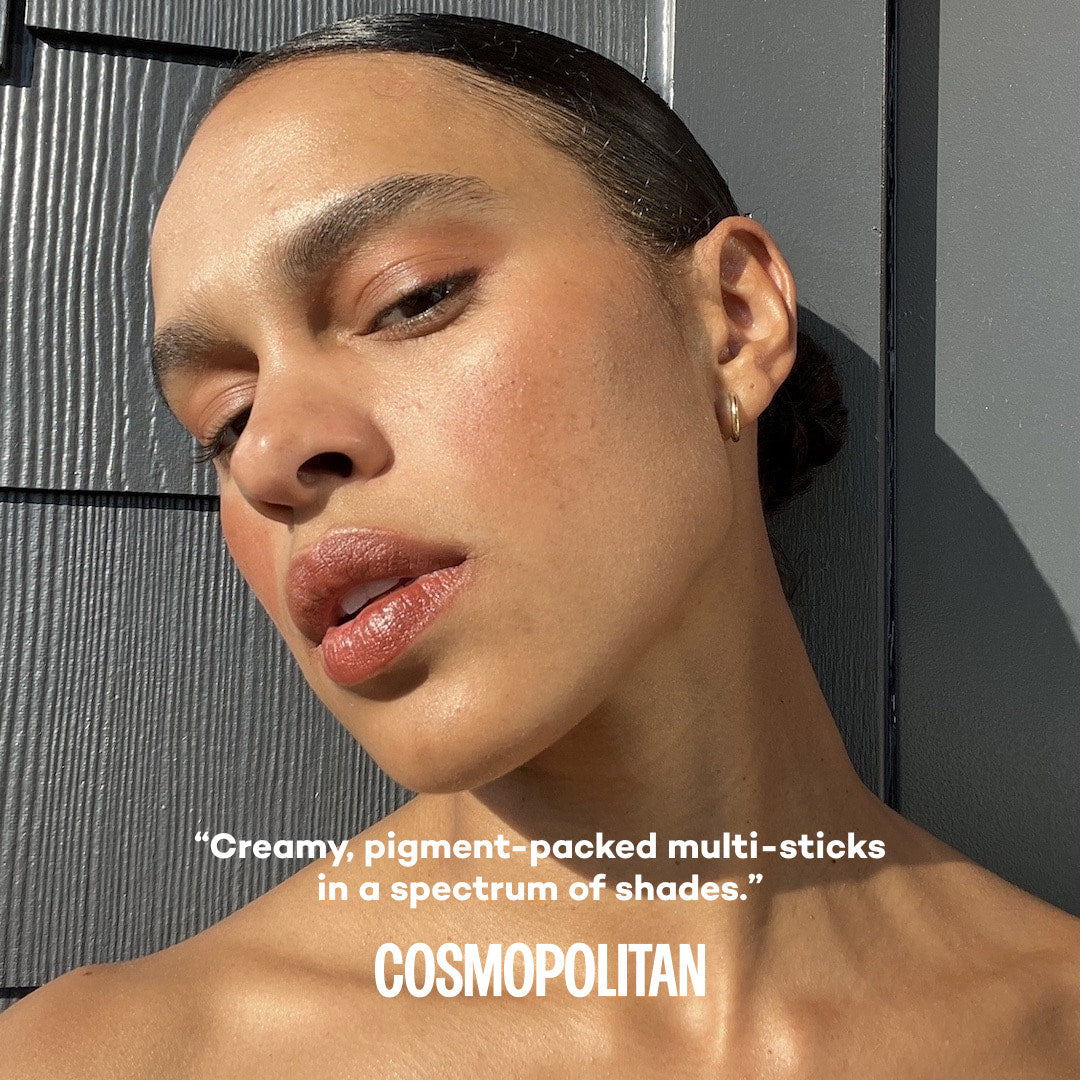 Woman with a neutral expression wearing makeup against a gray background, with text about cosmetic products.