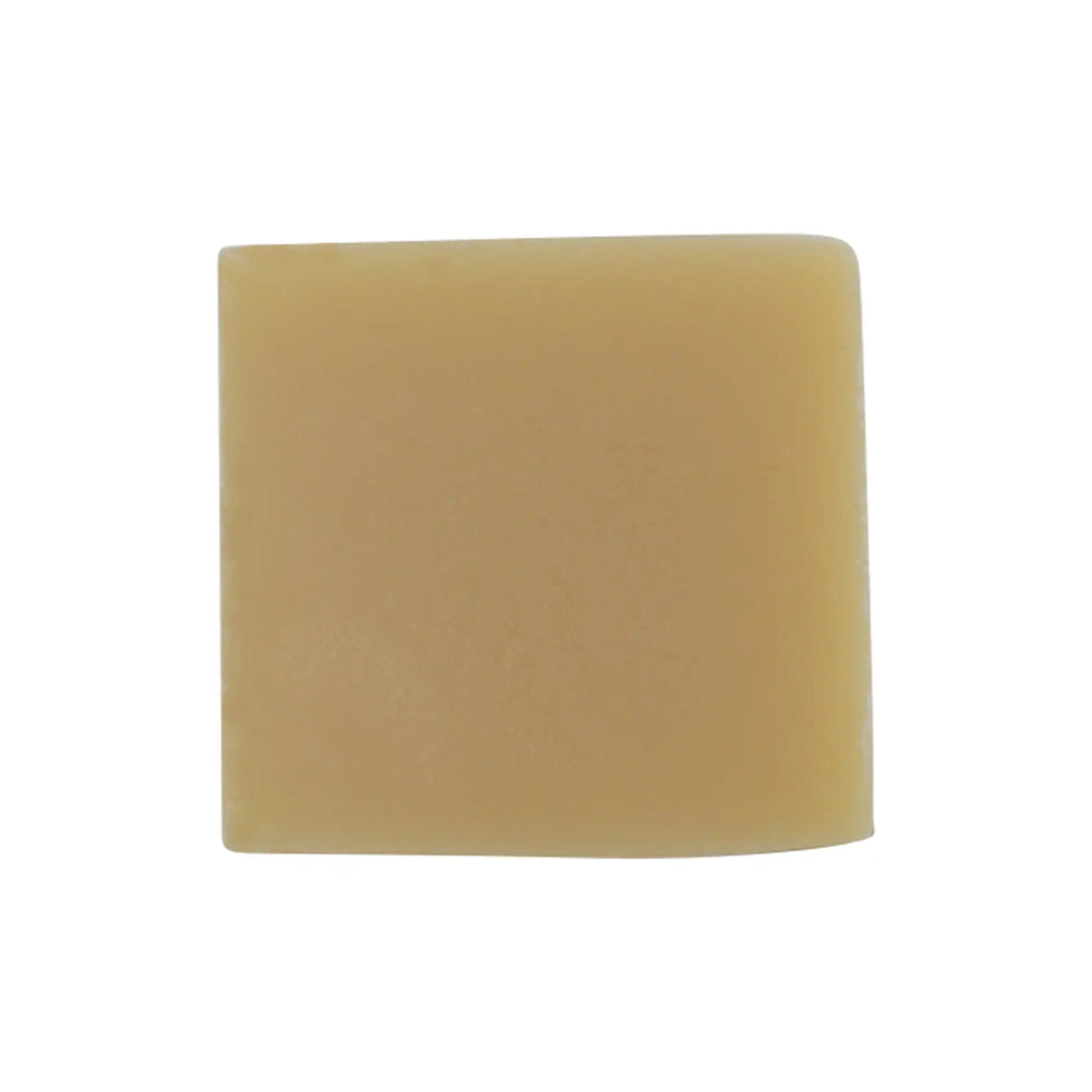 Yellow soap bar on a white background