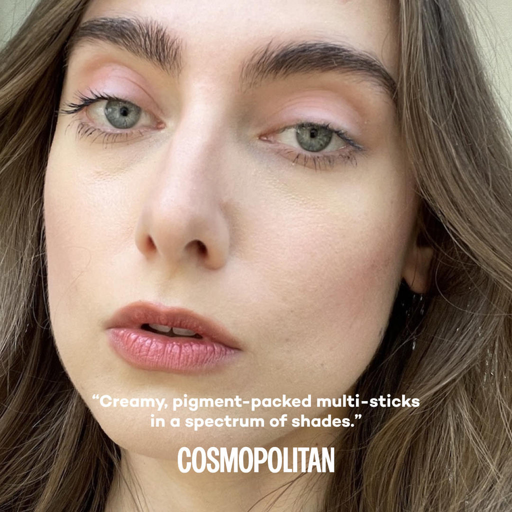 Close-up of a woman's face wearing makeup with text by Cosmopolitan about products.