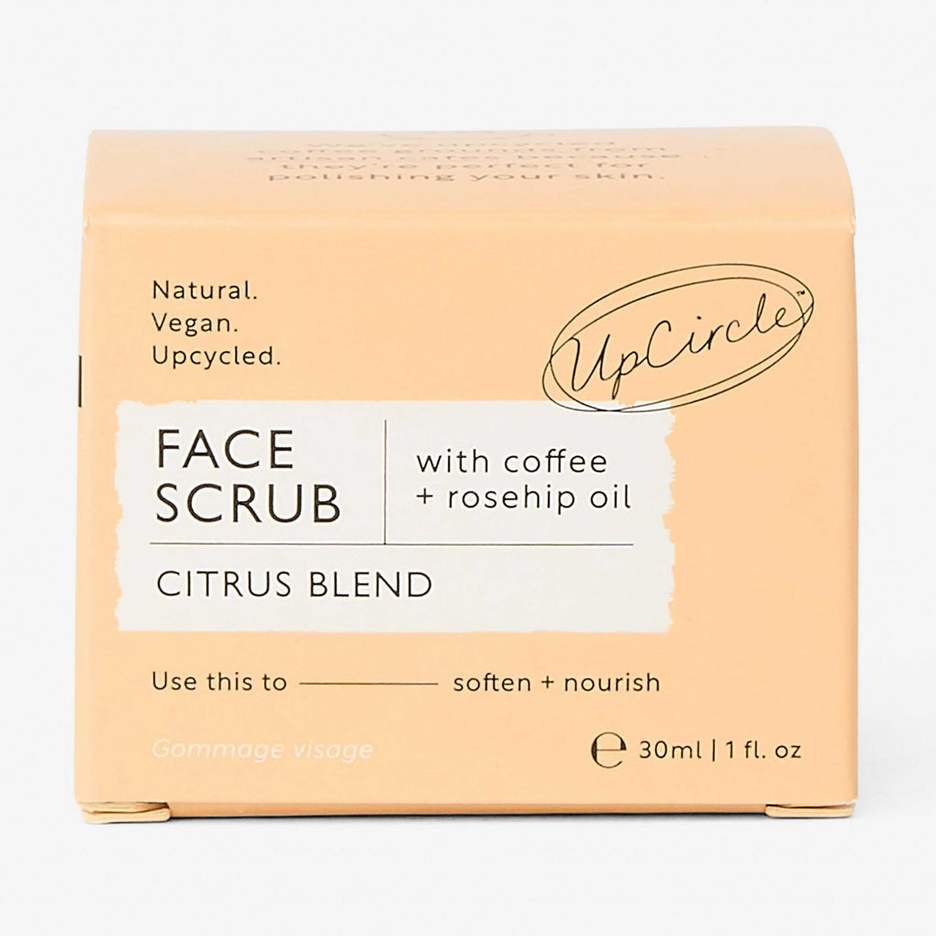 UpCircle face scrub packaging with citrus blend and coffee + rosehip oil on a white background