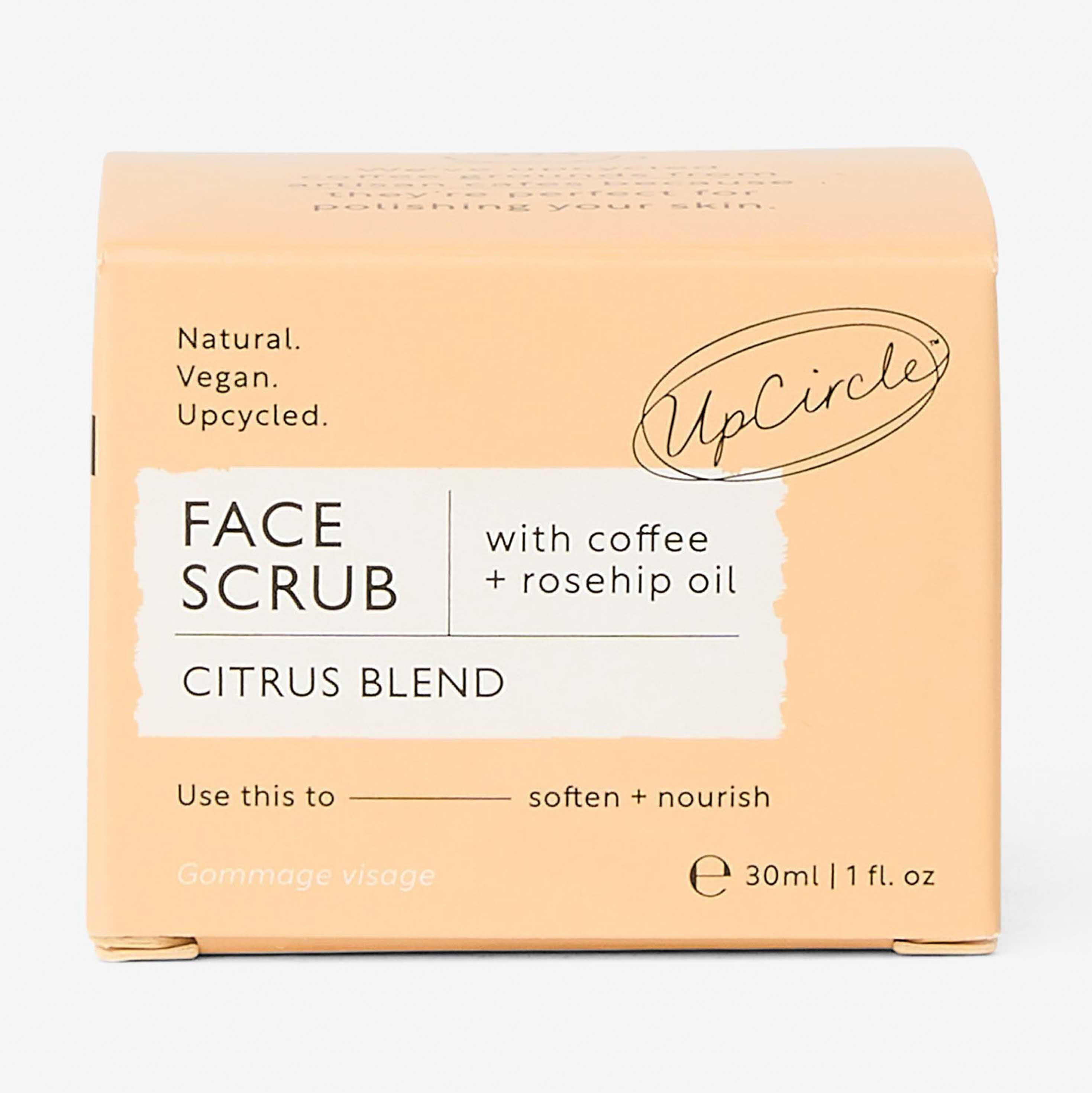 UpCircle face scrub packaging with citrus blend and coffee + rosehip oil on a white background