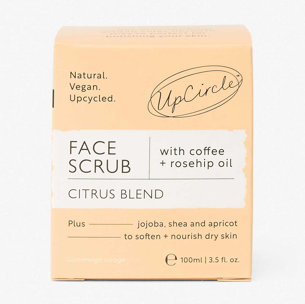 UpCircle Face Scrub packaging with citrus blend on a light beige background
