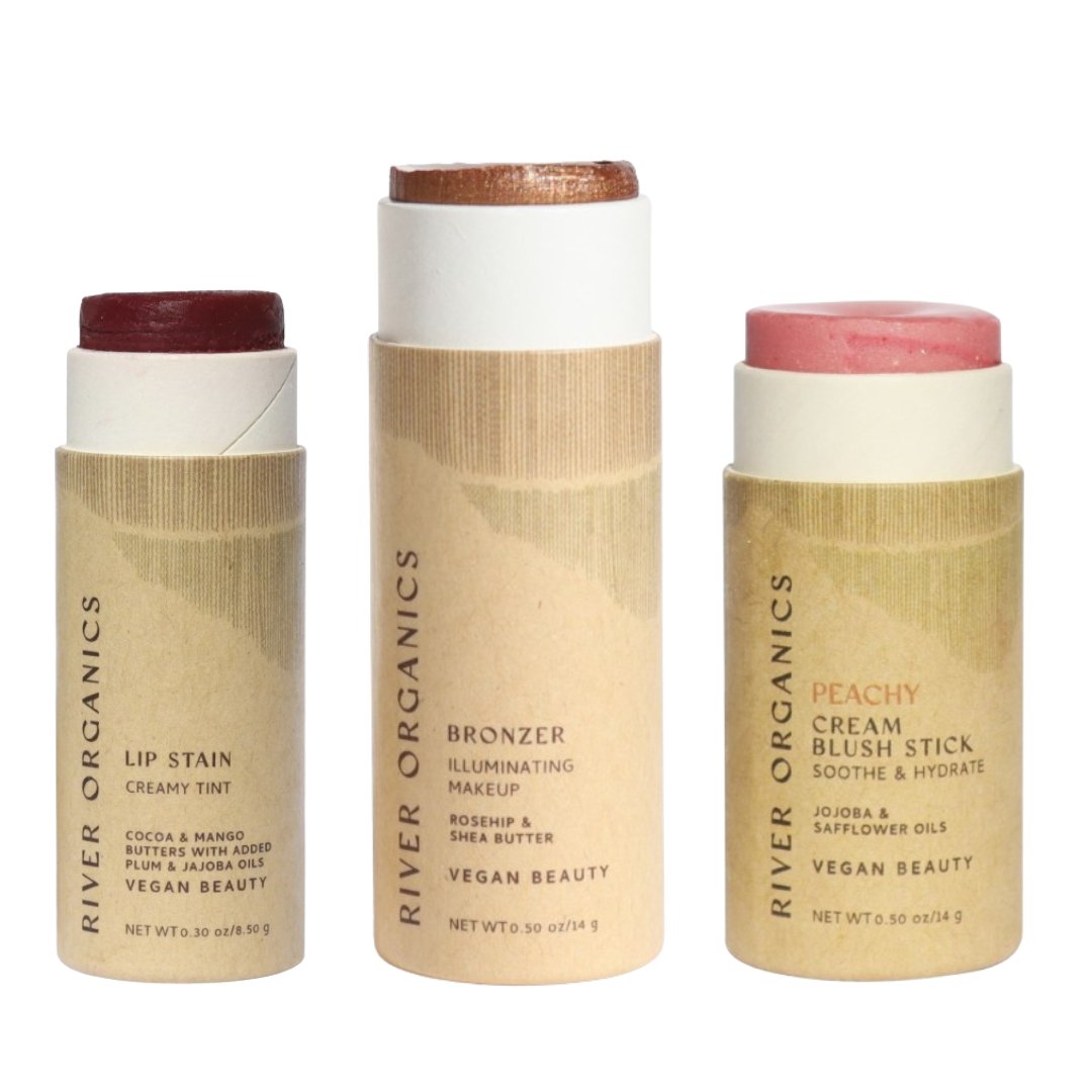 Three River Organics makeup sticks on a white background