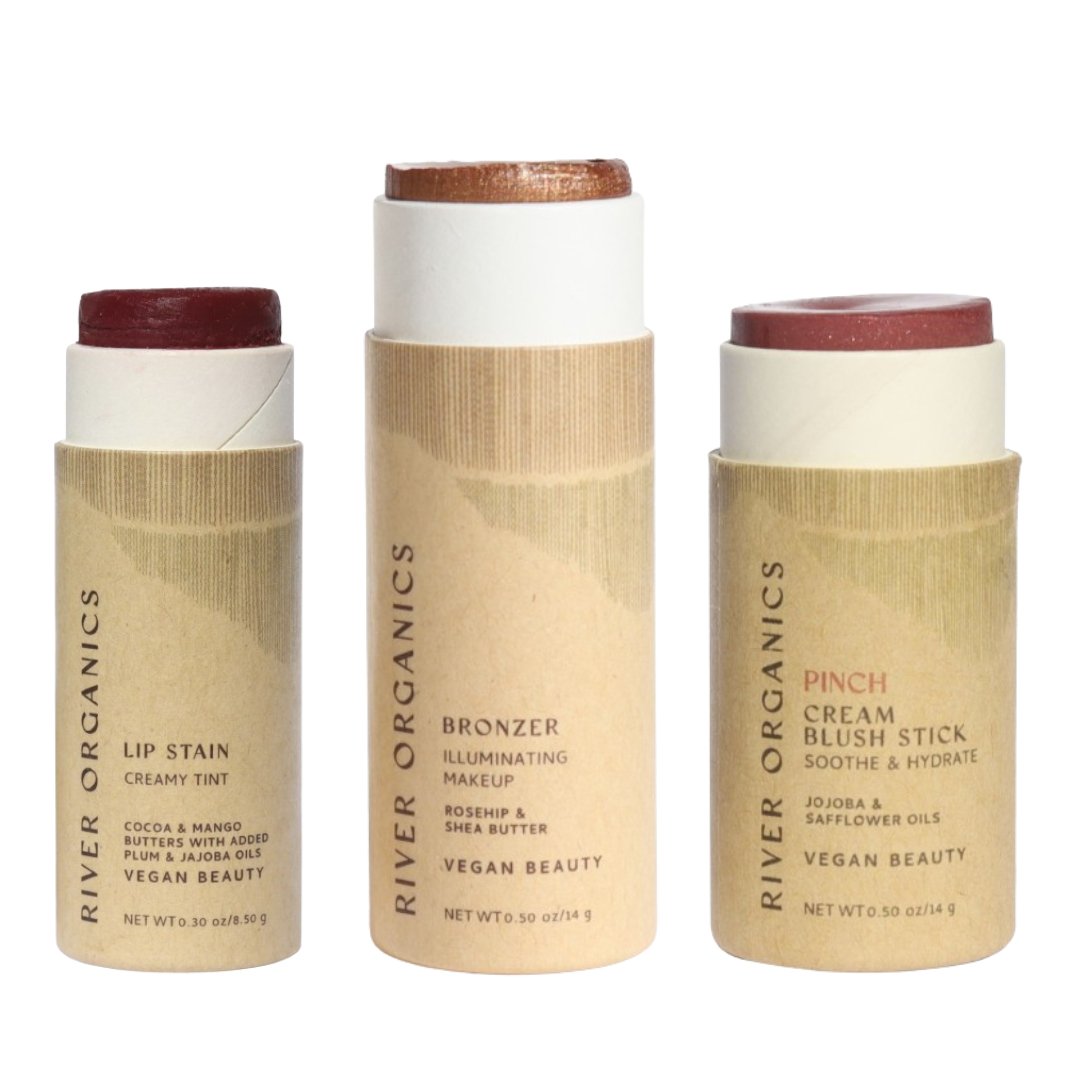 Three River Organics makeup sticks on a white background