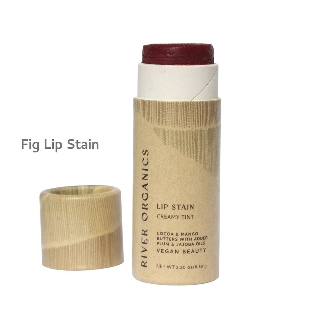 Lip stain stick with paper applicator on a white background